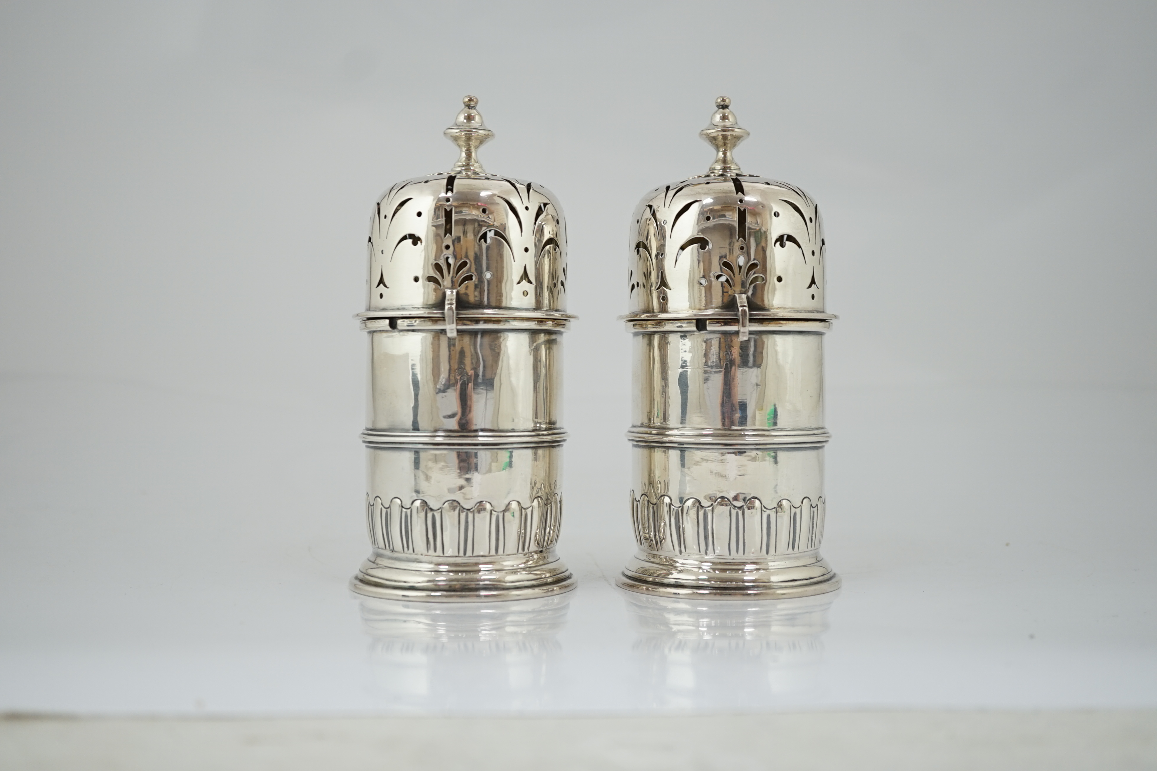 A good pair of late George I silver lighthouse casters, by William Spackman